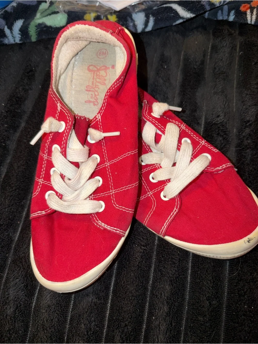 Red canvas sneakers with white stitching size 8